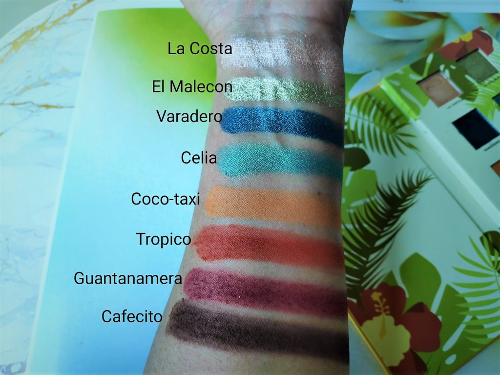 The Alamar Cosmetics Reina Del Caribe  palette features eight eye shadows in warm and cool tones. There are four mattes and four shimmery metallic shadows.
