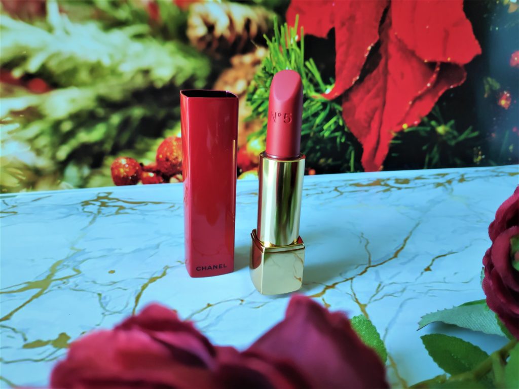 Chanel No.5 Rouge Allure Velvet Lipstick is a warm toned red with some cool pink tone sheen.