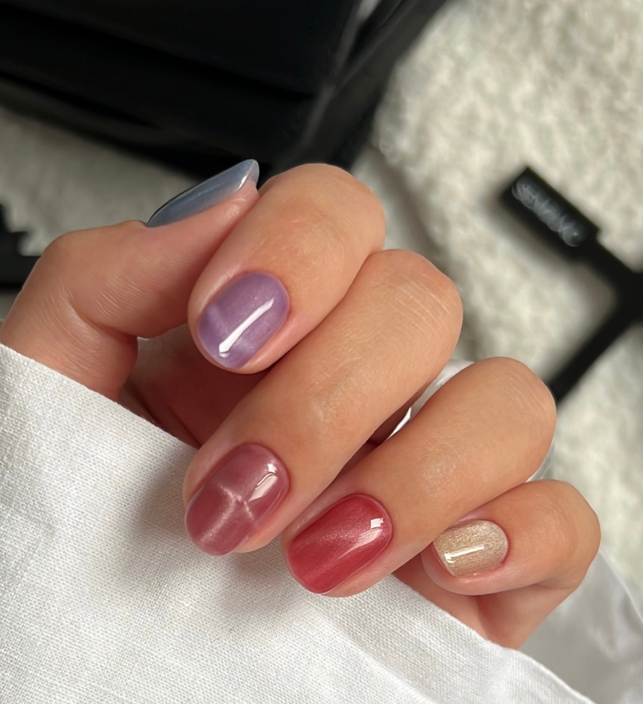 Chrome nails or glass nails in jewel tones are the latest trends in fall 2025