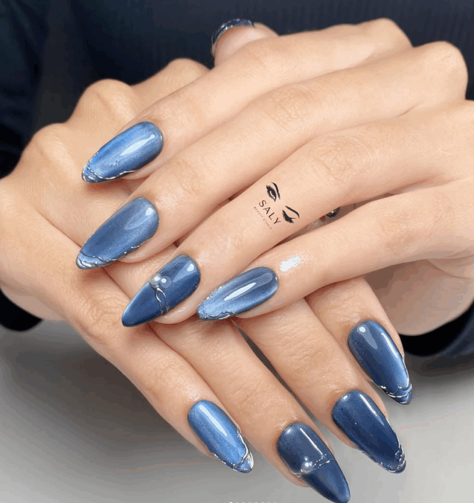 Chrome nails or glass nails in jewel tones are the latest trends in fall 2025