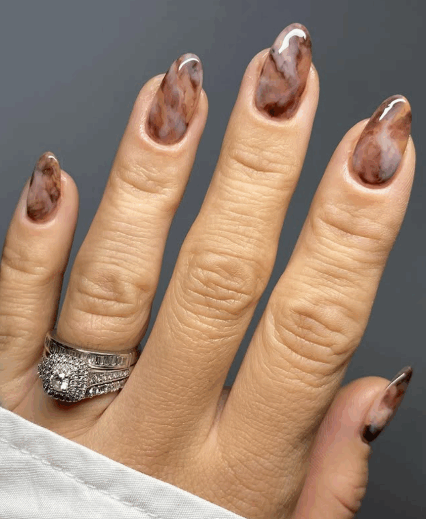 Shades of brown is one of the most trending and chic fall nail colors in 2025