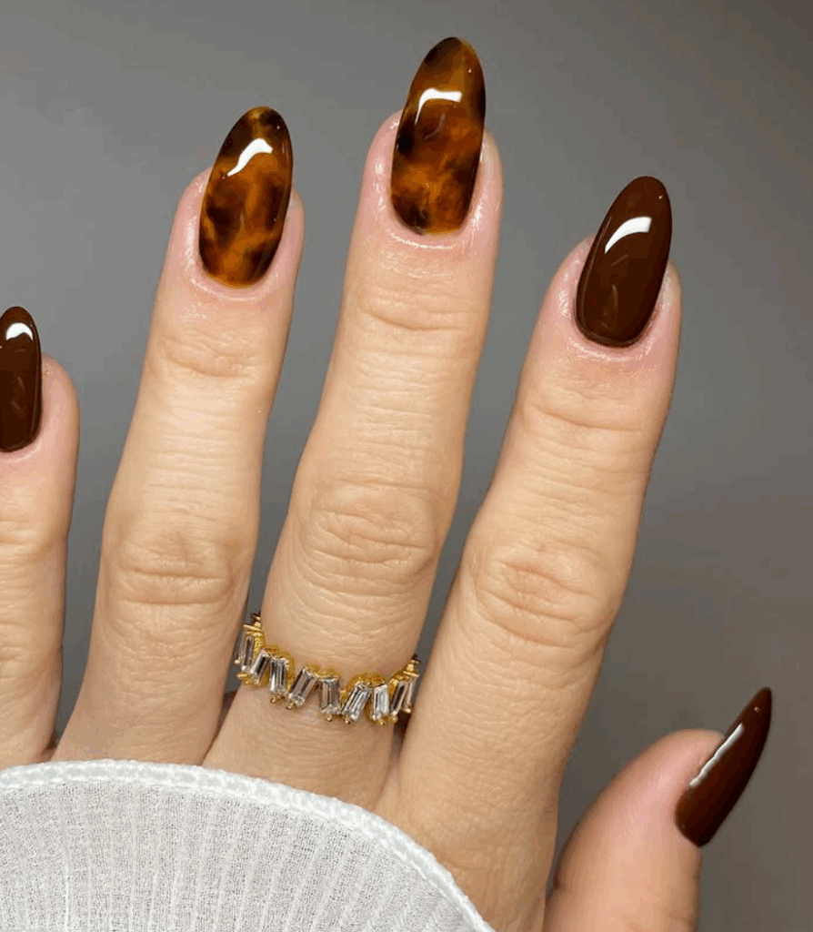 Shades of brown is one of the most trending and chic fall nail colors in 2025