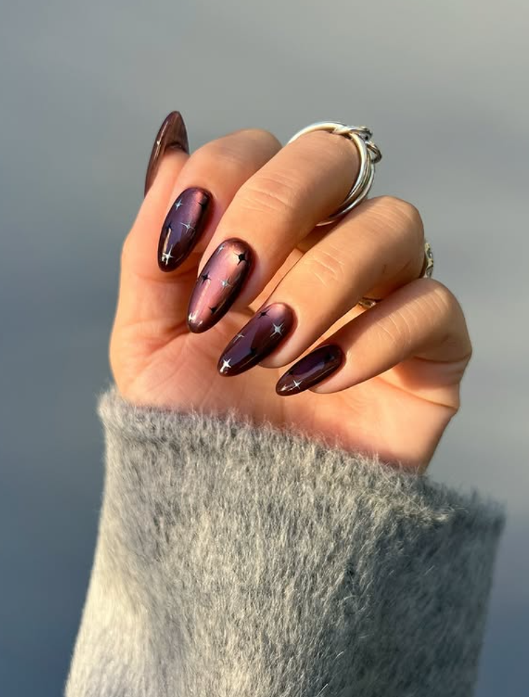 Chrome nails or glass nails in jewel tones are the latest trends in fall 2025
