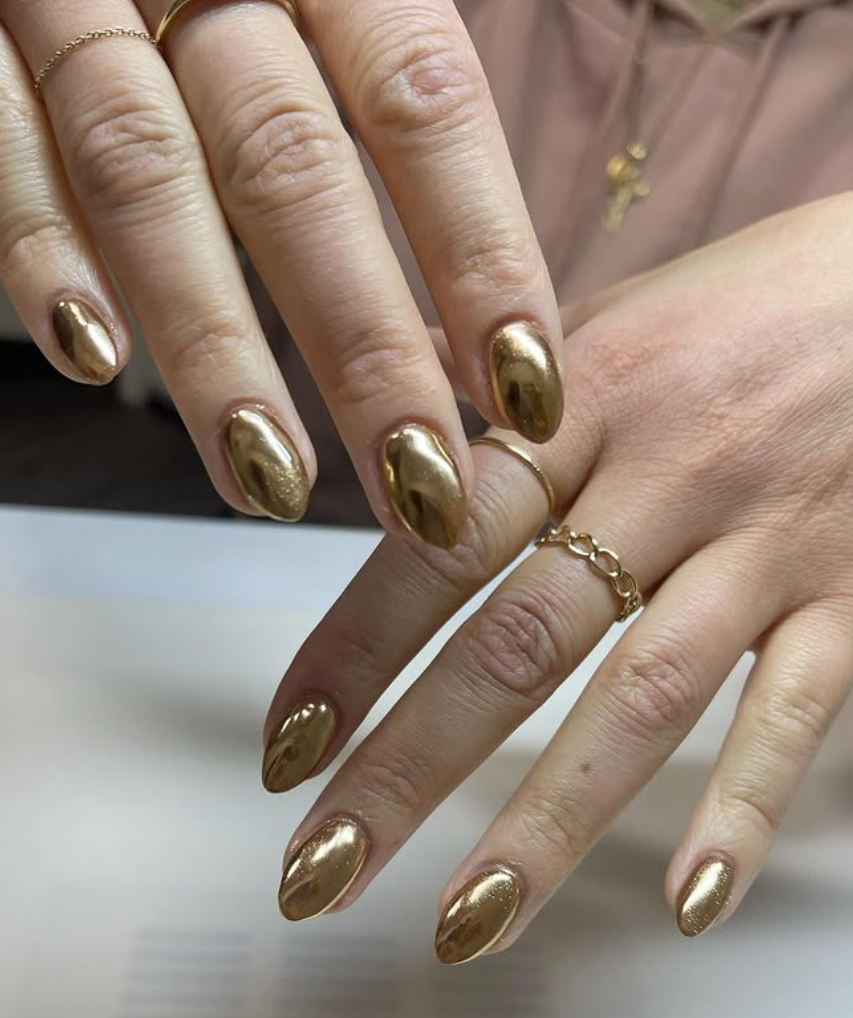 Chrome nails or glass nails in jewel tones are the latest trends in fall 2025