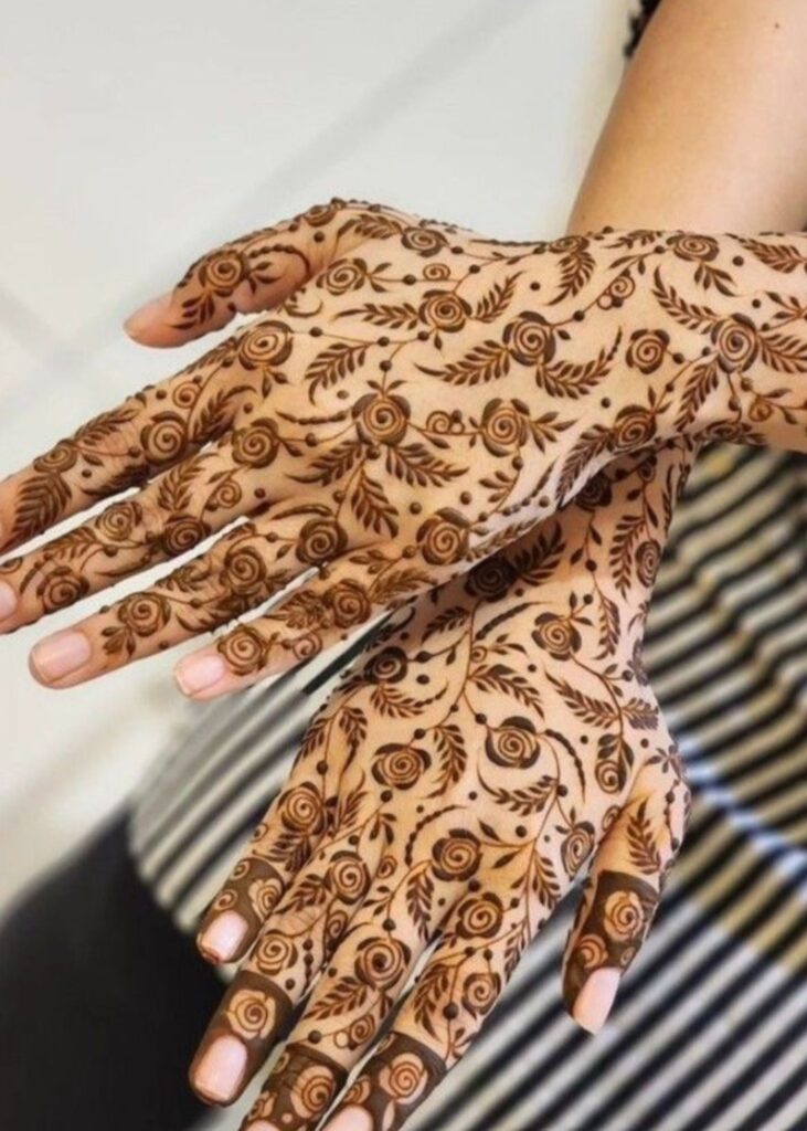 Floral mehndi design with roses and vines for festive look