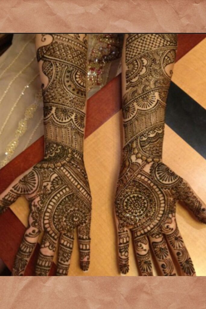 Arm length intricate Rajasthani mehndi design for brides