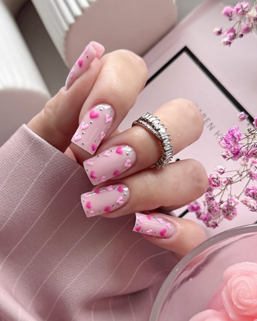 Pink Valentine’s Day nails with heart design