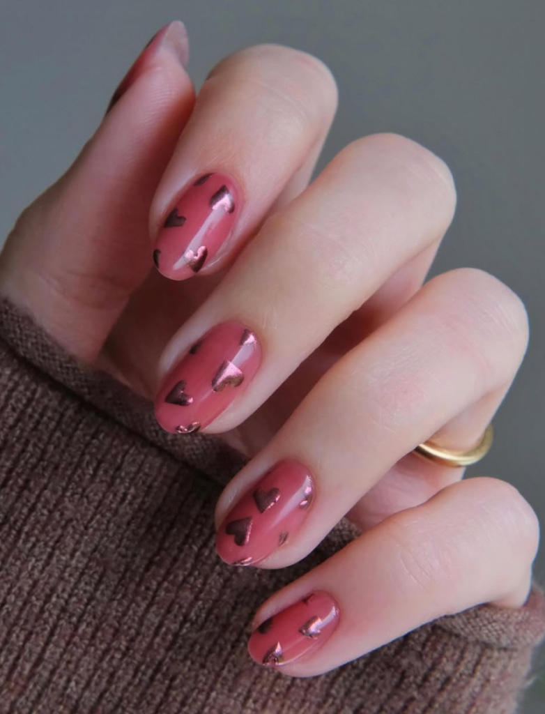 Red Valentine’s Day nails with heart design