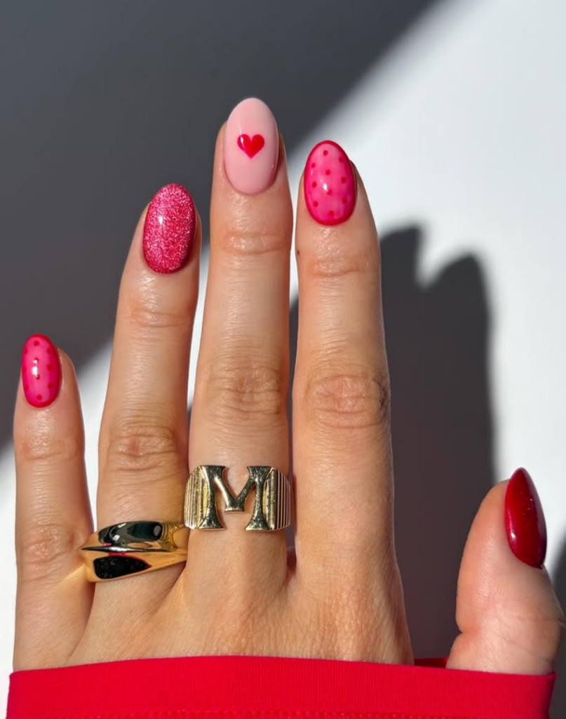 Red Valentine’s Day nails with heart design