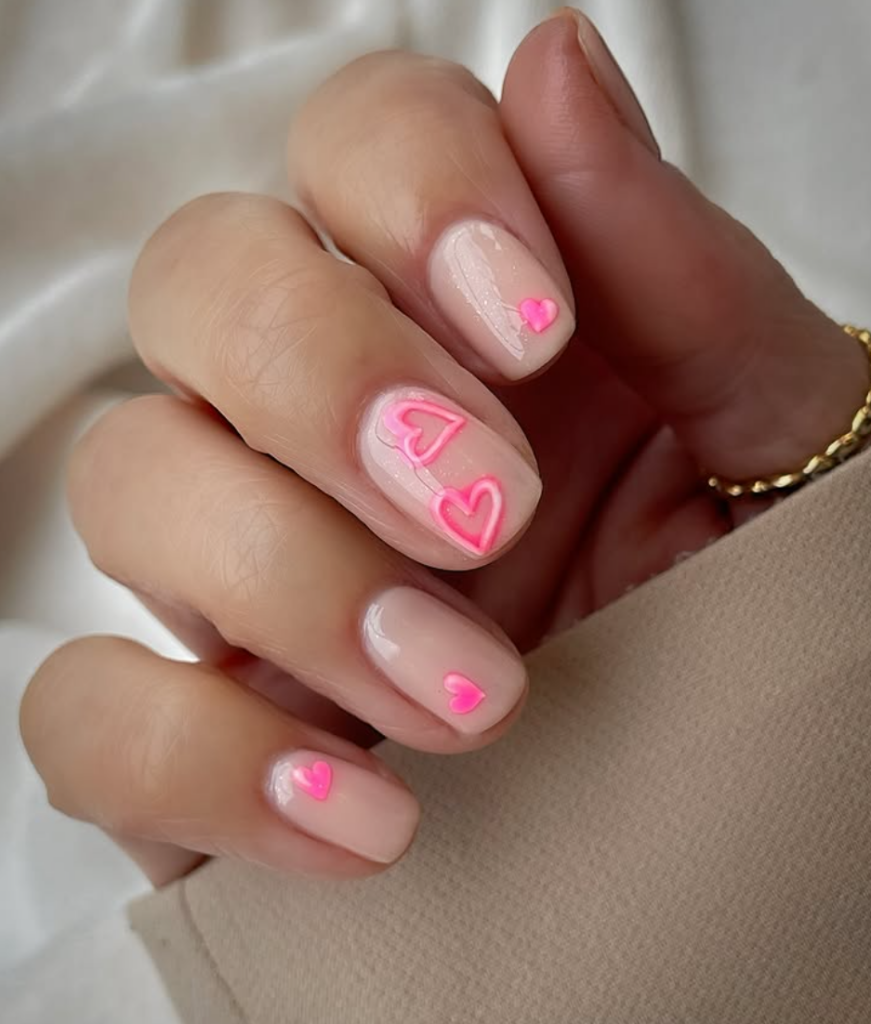Glowing heart design for Valentine's day nails