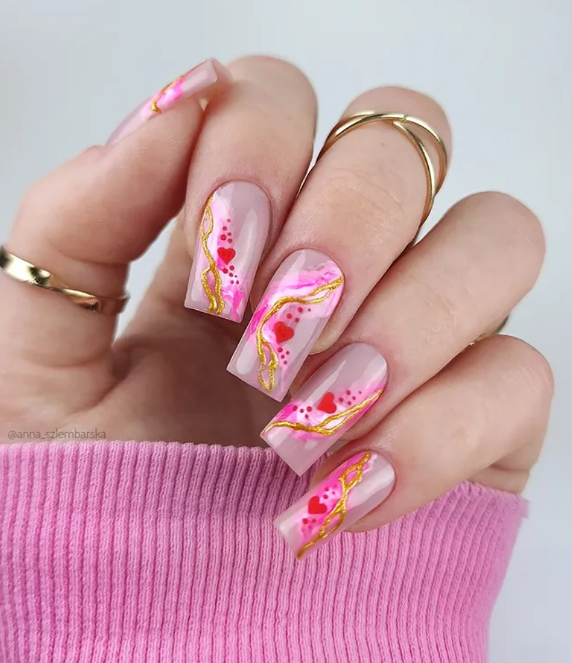 Red marble Valentine’s Day nails with heart design